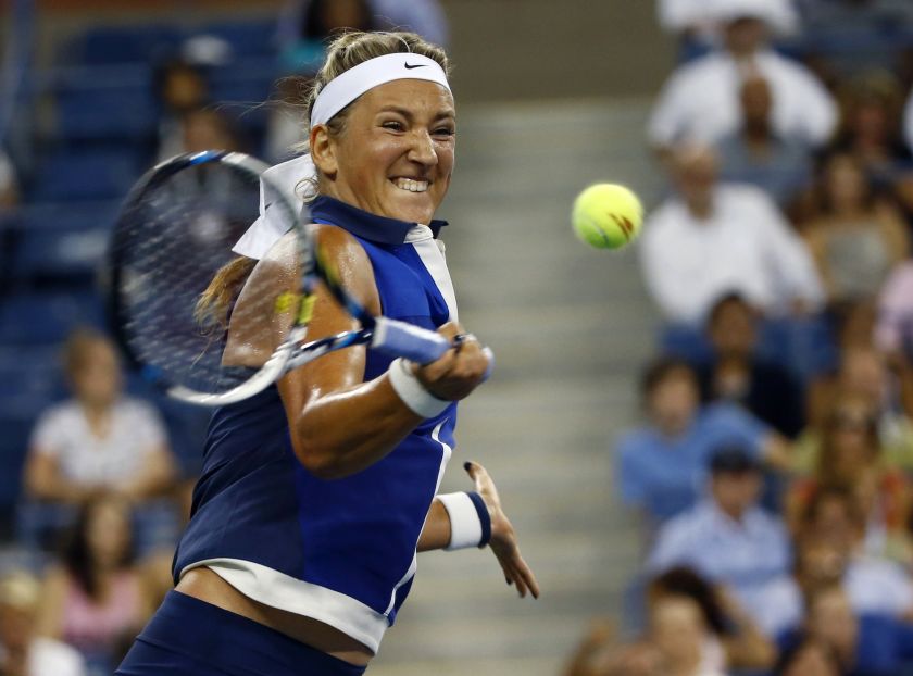 Victoria Azarenka of Belarus returns a shot to Aleksandra Krunic of Serbia during their women's singles match at the 2014 US Open tennis tournament in New York, September 1, 2014. 