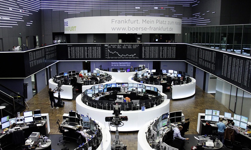 Traders are pictured at their desks in front of the DAX board at the Frankfurt stock exchange August 28, 2014. u00e2u20acu201d Reuters pic