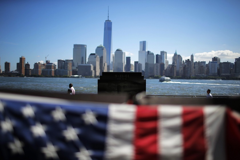 People walk near the 9/11 memorial in Exchange Place, New Jersey September 10, 2014. u00e2u20acu201d Reuters pic