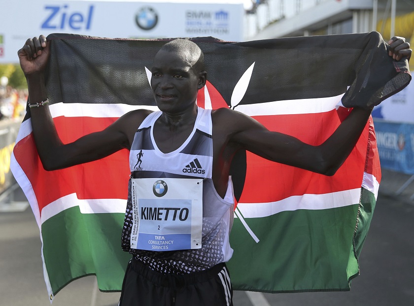 Dennis Kimetto of Kenya holds up his national flag as he celebrates winning the 41st Berlin marathon, September 28, 2014.  u00e2u20acu201d Reuters pic