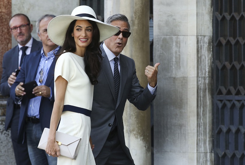 US actor George Clooney and his wife Amal Alamuddin arrive at Venice city hall for a civil ceremony to formalize their wedding in Venice September 29, 2014. u00e2u20acu201d Reuters pic