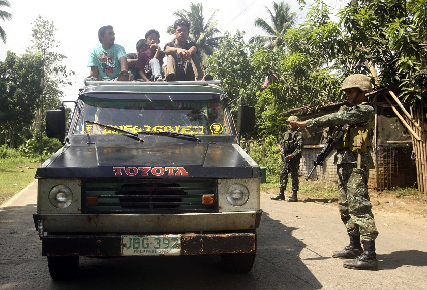 Soldiers stop a vehicle at a military checkpoint in Jolo, Sulu, southern Philippines September 25, 2014. u00e2u20acu201d Reuters pic