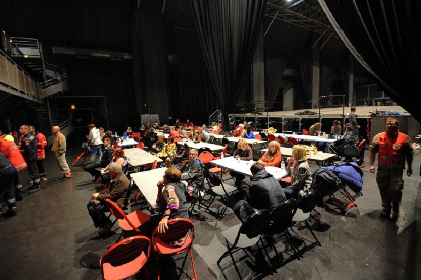 People wait at the Zenith in Montpellier, where they have found shelter, early on September 30, 2014.  u00e2u20acu201d AFP pic