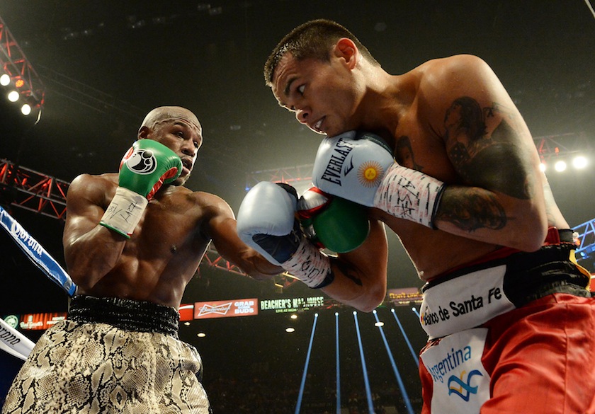 Floyd Mayweather (green gloves) and Marcos Maidana (blue gloves) compete during their WBC & WBA Welterweight and WBC Superwelter Weight title fight at the MGM Grand Garden Arena. u00e2u20acu201d Reuters pic