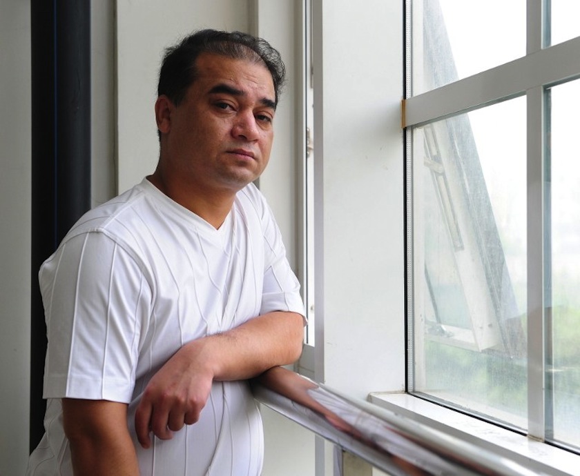 University professor, blogger, and member of the Muslim Uighur minority, Ilham Tohti pauses before a classroom lecture in Beijing on June 12, 2010. u00e2u20acu201d AFP pic