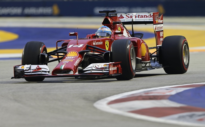 Rerrari Formula One driver Fernando Alonso of Spain takes a corner during the third practice session of the Singapore F1 Grand Prix at the Marina Bay street circuit in Singapore, September 20, 2014. u00e2u20acu201d Reuters pic