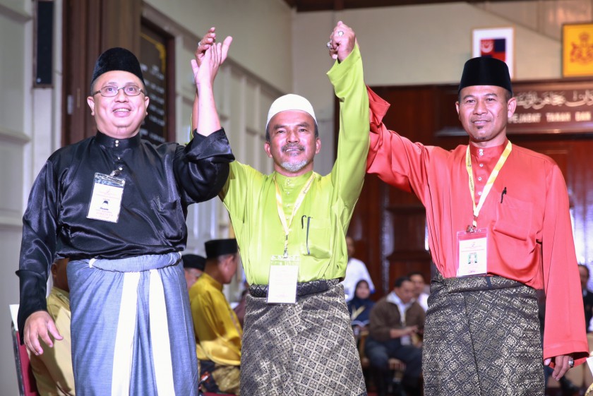 The three candidates for the Pengkalan Kubor by-election, (from left) independent Izat Bukhary Ismail Bukhary, PAS's Wan Rosdi Wan Ibrahim and Umno's Mat Razi Mat Ail, after nominations closed, September 13, 2014. u00e2u20acu201d Picture by Saw Siow Feng