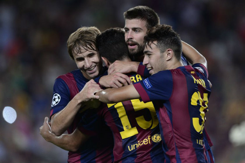 Barcelona's defender Gerard Pique (centre) celebrates with Barcelona's midfielder Sergi Samper (left) and Barcelona's forward Munir (right) after scoring during the UEFA Champions League football match. u00e2u20acu201d AFP pic