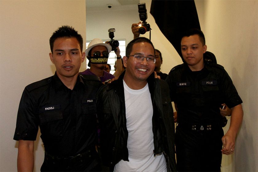 Social activist Ali Abd Jalil (centre) had fallen foul of laws that protect royalty from insults and spent nearly three weeks in prison while in remand. ― Picture by Yusof Mat Isa