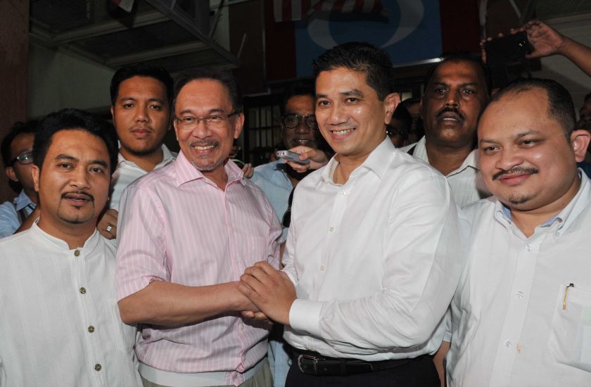 PKR deputy president Azmin Ali shaking hands with Datuk Seri Anwar Ibrahim outside the PKR headquarters, September 21, 2014.