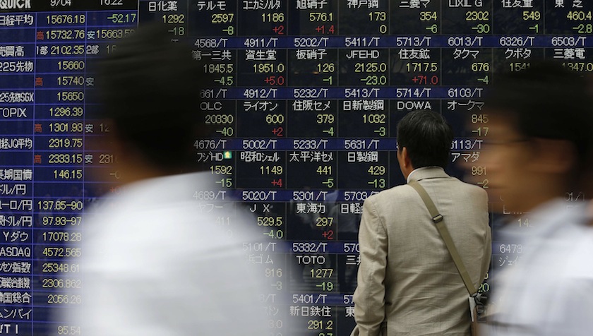 A man looks at an electronic stock quotation board outside a brokerage in Tokyo September 4, 2014. u00e2u20acu201d Reuters pic