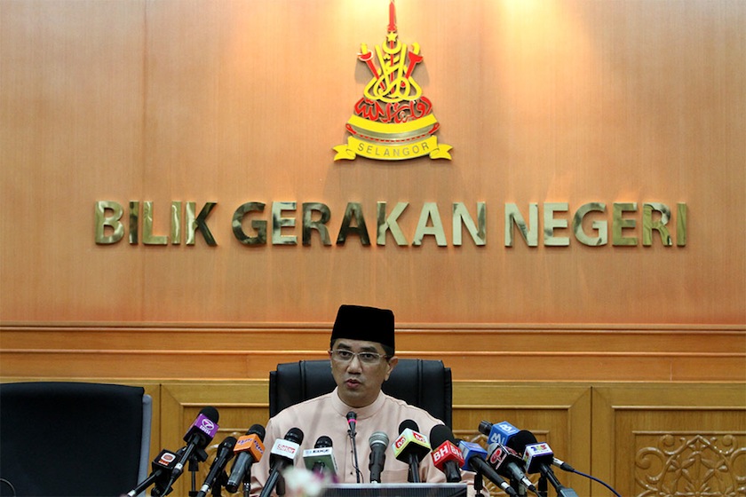 Azmin unveiled his 10-man executive council line-up, reducing the number of seats offered to PAS from four to three. u00e2u20acu201d PIcture by Yusuf Mat Isa 