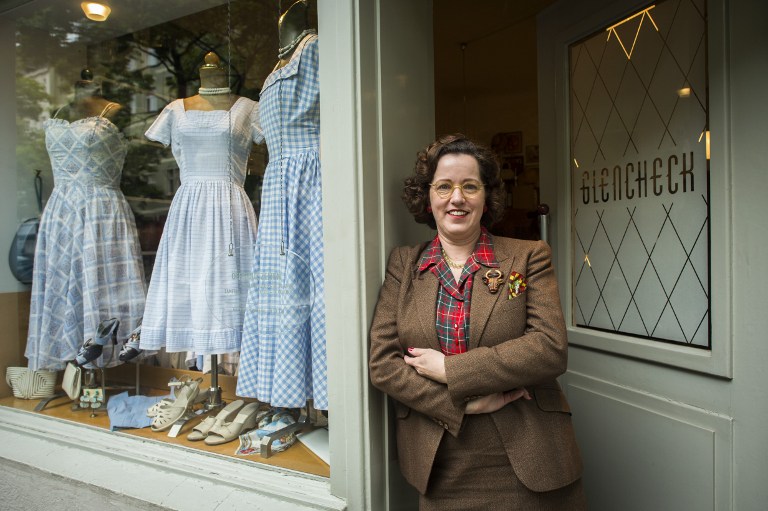 Shop owner Constanze Pelzer poses for a picture on the doorstep of her 1920s-1950s vintage shop u00e2u20acu02dcGlenchecku00e2u20acu2122 in the Wilmersdorf area of Berlin on May 2, 2014. u00e2u20acu201d AFP pic