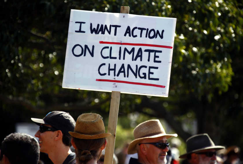  A protester holds a banner as he participates in a rally called the Climate Change Action March in Sydney September 21, 2014. u00e2u20acu201d Reuters picnn