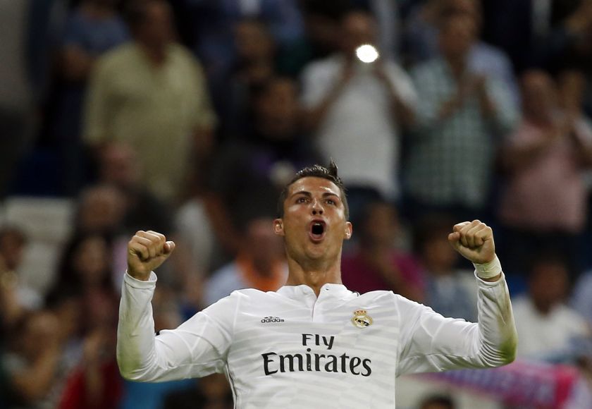 Real Madrid's Cristiano Ronaldo celebrates after scoring his fourth goal against Elche during their Spanish first division match at Santiago Bernabeu stadium in Madrid September 23, 2014.  u00e2u20acu2022 Reuters pic