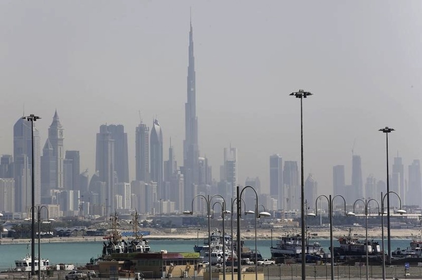 The skyline is seen with the Burj Khalifa as ships dock at Port Rashid, in Dubai May 26, 2013. u00e2u20acu201d Reuters pic