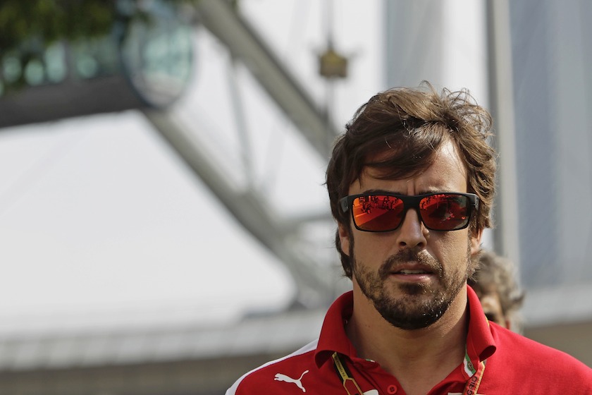 Ferrari Formula One driver Fernando Alonso of Spain arrives at the paddock before the first practice session of Singapore F1 Grand Prix September 19, 2014. u00e2u20acu201d Reuters pic