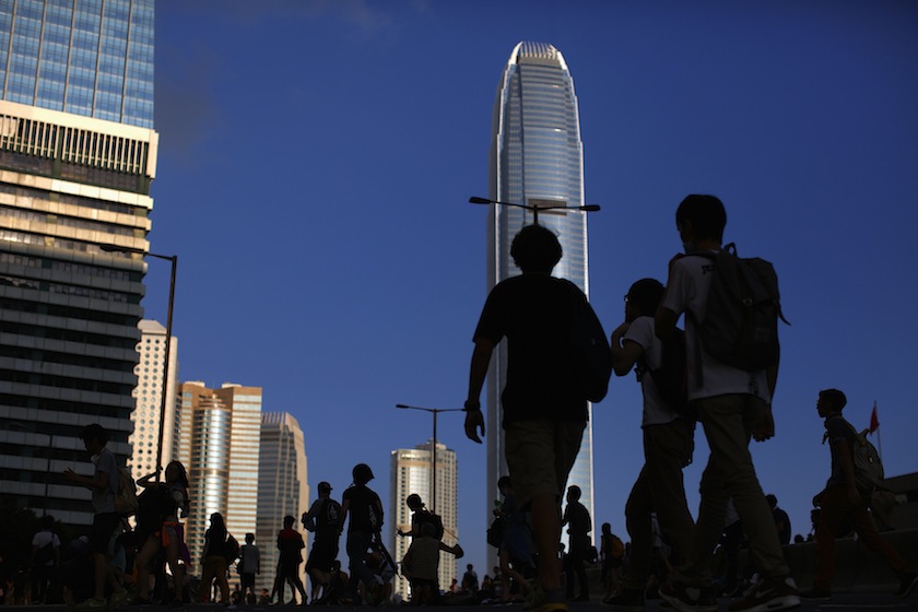 Protesters walk over a bridge as they block the main street to the financial Central district, outside the government headquarters in Hong Kong, September 29, 2014. u00e2u20acu201d Reuters pic