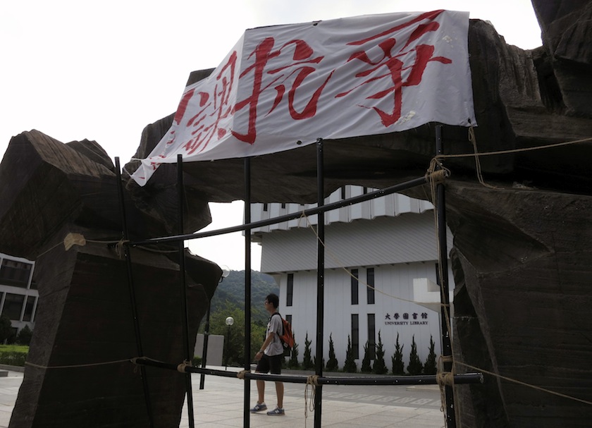 A banner with Chinese characters saying 'boycott class to protest' is displayed on a sculpture at University Mall inside the Chinese University of Hong Kong September 20, 2014.u00c2u00a0u00e2u20acu201d Reuters pic
