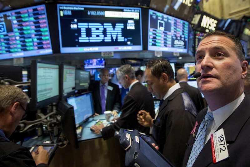 Traders gather at the post that trades IBM on the floor of the New York Stock Exchange October 20, 2014. u00e2u20acu201d Reuters pic