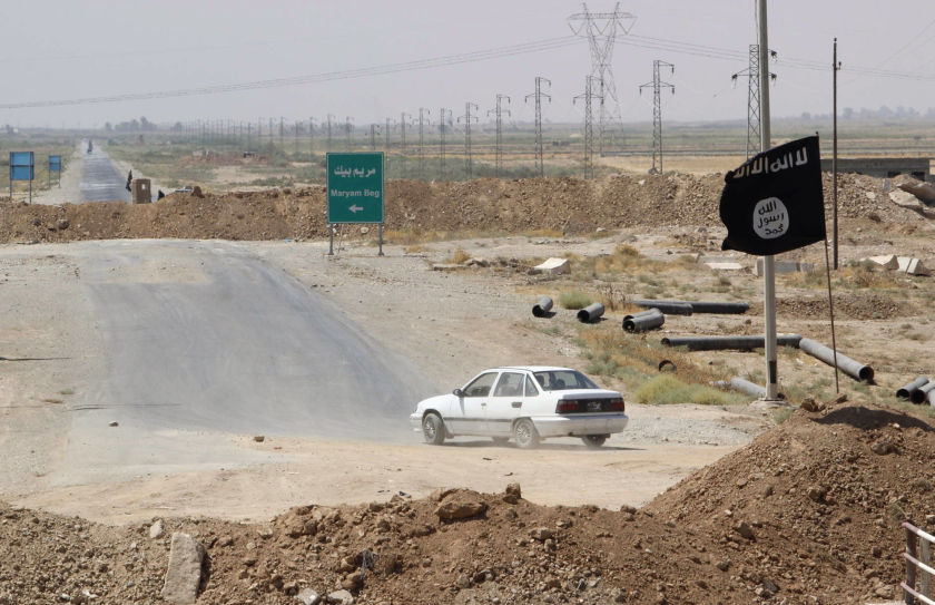 A flag belonging to Islamic State militants at the end of a bridge in southern Kirkuk, August 23, 2014. u00e2u20acu201d Reuters pic