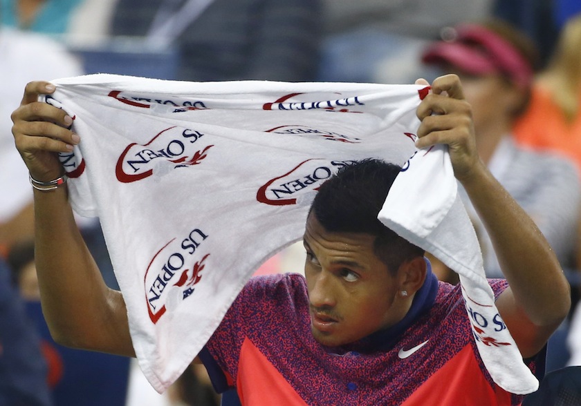 Nick Kyrgios of Australia covers his head with a towel during a break in his men's singles match  against Tommy Robredo of Spain at the 2014 US Open tennis tournament in New York, August 31, 2014. u00e2u20acu201d Reuters pic