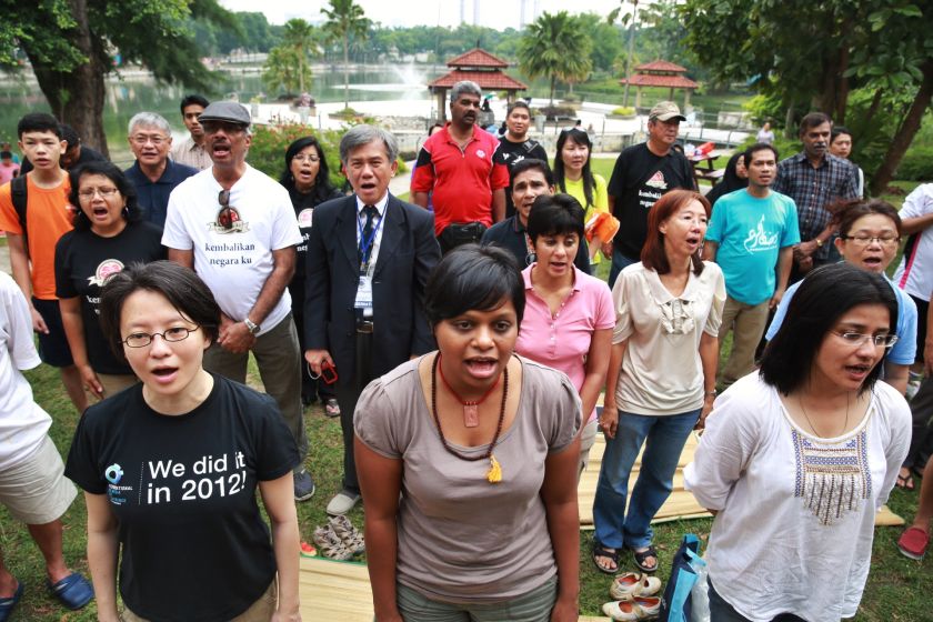 People singing the national anthem Negaraku at the Malaysia Day picnic at Taman Jaya, September 16, 2014. u00e2u20acu201d Picture by Saw Siow Feng