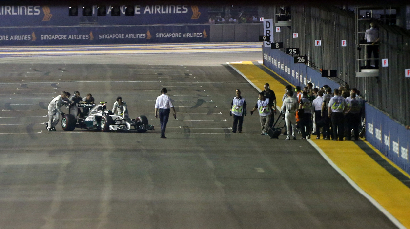 Mercedes Formula One driver Nico Rosberg of Germany has his car pushed back to the pit lane just before the start of the Singapore F1 Grand Prix at the Marina Bay street circuit in Singapore September 21, 2014. u00e2u20acu201d Reuters pic