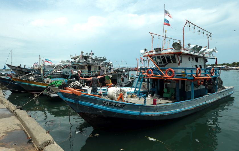 Fishing trawlers in Semporna have been affected by the dusk to dawn curfew imposed since July 19. u00e2u20acu201d Picture by Julia Chan