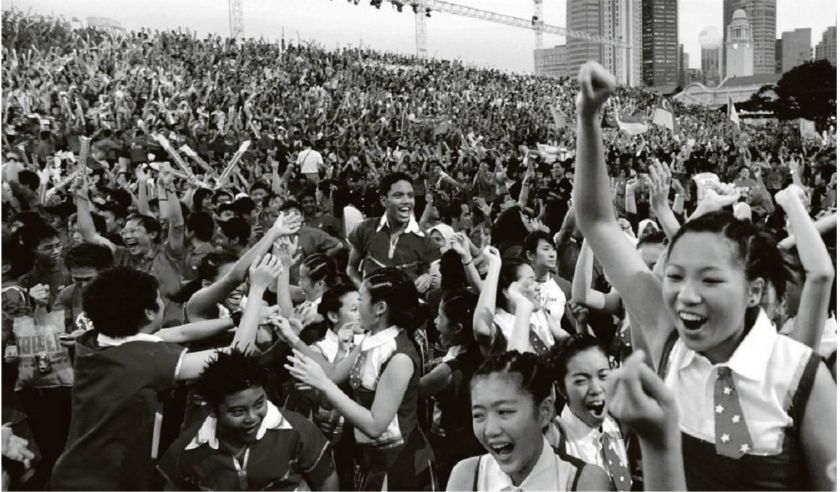 Singaporean youth cheer after hearing the announcement of the republic winning the bid to host the inaugural 2010 Youth Olympic Games. u00e2u20acu201d TODAY picn