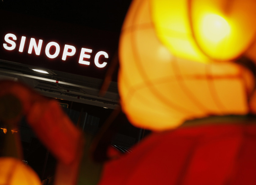A Sinopec sign displayed at its gas station is seen behind a Chinese New Year lantern installation in Hong Kong in this February 5, 2013 file photo. u00e2u20acu201d Reuters pic