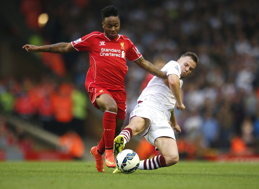 Liverpool's Raheem Sterling (left) challenges Aston Villa's Tom Cleverley during their English Premier League match at Anfield in Liverpool, northern England September 13, 2014.  u00e2u20acu201d Reuters pic