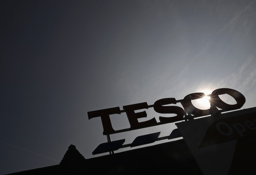 A view of the signage of a Tesco Extra store silhouetted against the sun in southwest London in this September 22, 2014 file photo. u00e2u20acu201d Reuters pic