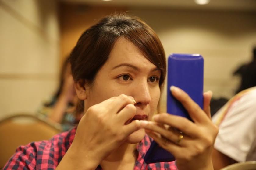 Transgender Erin, 36, putting on makeup before the event. u00e2u20acu201d Picture by Choo Choy May