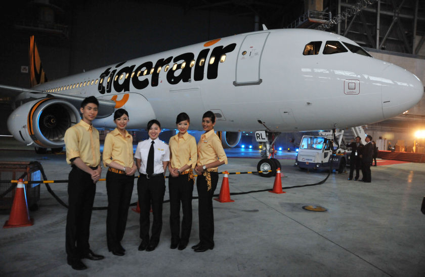 Flight attendants pose during the Tigerair Taiwan launch conference in Taoyuan on December 16, 2013. u00e2u20acu201d AFP pic