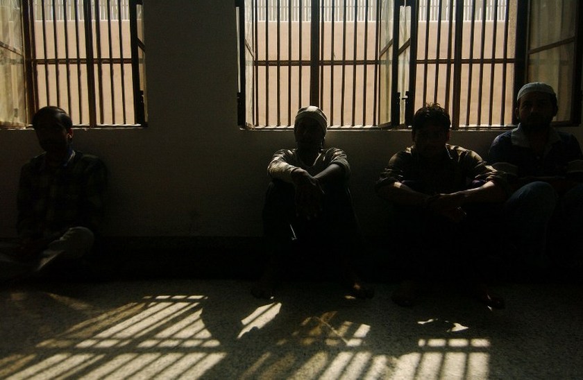 Indian prisoners in a cell of New Delhi's Tihar jail, where juveniles without IDs are thrown in with hardened criminals. u00e2u20acu201d AFP pic