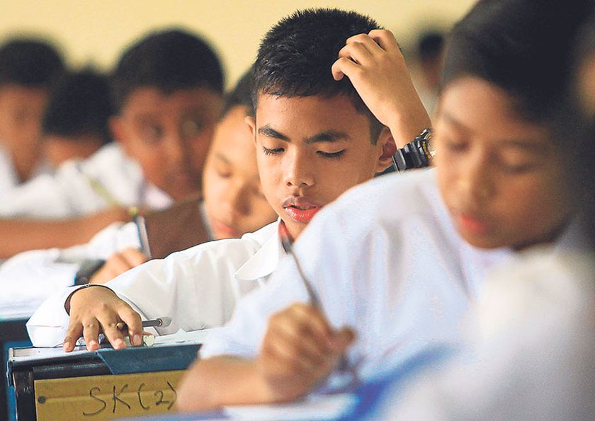 Even pupils themselves claim examination questions are the same of that which have been provided by their tuition centres. u00e2u20acu201d Picture by Hari Anggara