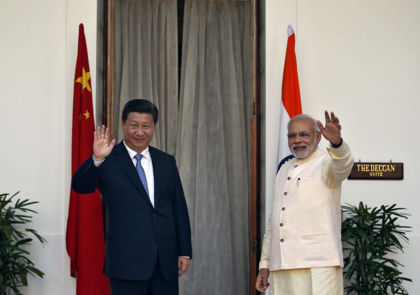 India's Prime Minister Narendra Modi (right) and China's President Xi Jinping wave to the media ahead of their meeting at Hyderabad House in New Delhi September 18, 2014. u00e2u20acu201d Reuters pic