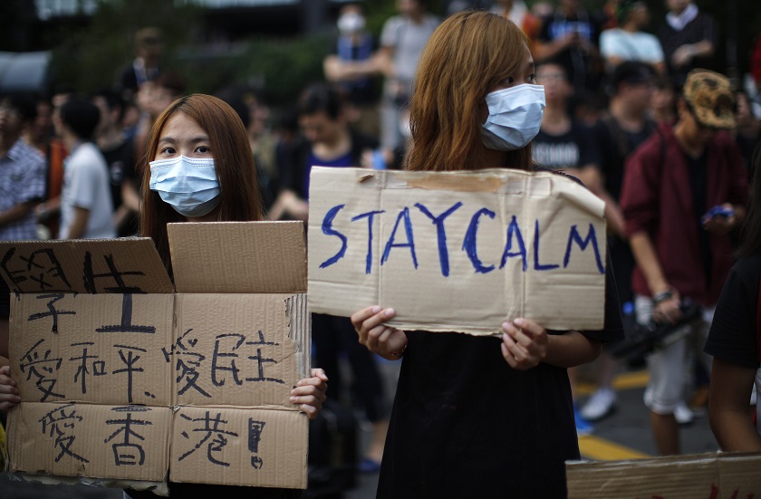 Protesters gather around the Golden Bauhinia Square during an official flag raising ceremony to commemorate the Chinese National Day in Hong Kong, October 1, 2014. u00e2u20acu201d Reuters pic
