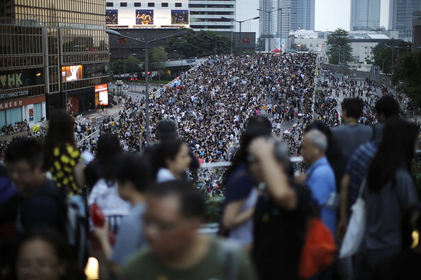Protesters walk along a blocked off area outside of the government headquarters building in Hong Kong, October 1, 2014. u00e2u20acu201d Reuters pic