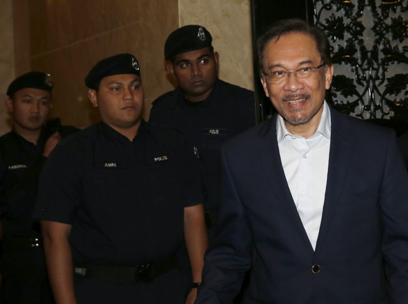 Opposition leader Datuk Seri Anwar Ibrahim leaves court for a recess during his final appeal against a conviction for sodomy at the Palace of Justice in Putrajaya October 30, 2014. u00e2u20acu201d Reuters pic