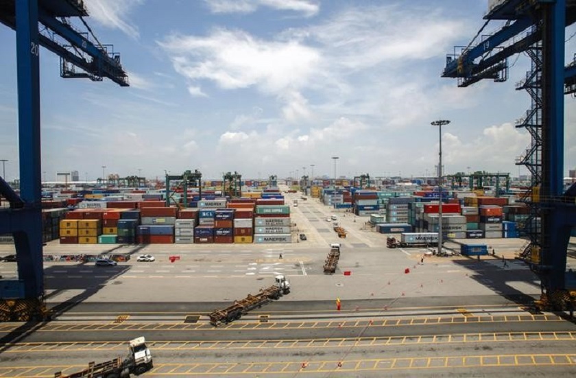 Containers are transported at Nansha port in Guangzhou, Guangdong province in this June 26, 2014 file picture. u00e2u20acu201d Reuters pic 