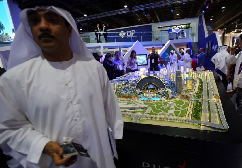 File picture shows visitors viewing a scale model of the Mall of the World to be built in Dubai, to become the worldu00e2u20acu2122s first temperature-controlled city capable of receiving 180 million visitors a year. u00e2u20acu201d AFP pic