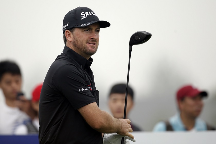 Graeme McDowell of Northern Ireland tees off on the 15th hole during the second round of the BMW Masters 2014 golf tournament at Lake Malaren Golf Club in Shanghai, October 31, 2014. u00e2u20acu201d Reuters pic
