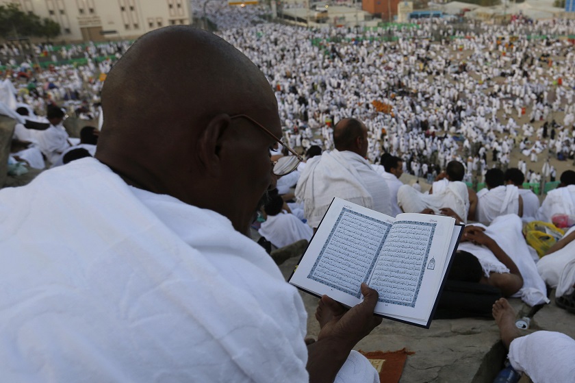 A Muslim pilgrim reads the Quran on Mount Mercy on the plains of Arafat during the annual haj pilgrimage, outside the holy city of Mecca, October 6, 2014. u00e2u20acu201d Reuters pic