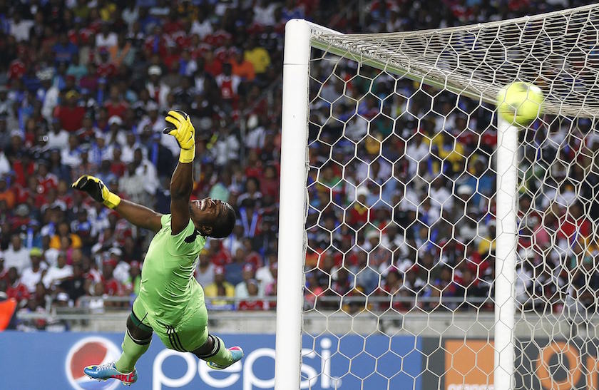 Goalkeeper Senzo Meyiwa of South Africau00e2u20acu2122s Orlando Pirates fails to save a goal by Mohamed Aboutrika of Egypt's Al Ahli during the first leg of their African Champions League final match in Soweto, in this November 2, 2013 file picture. u00e2u20acu201d Reuters pic