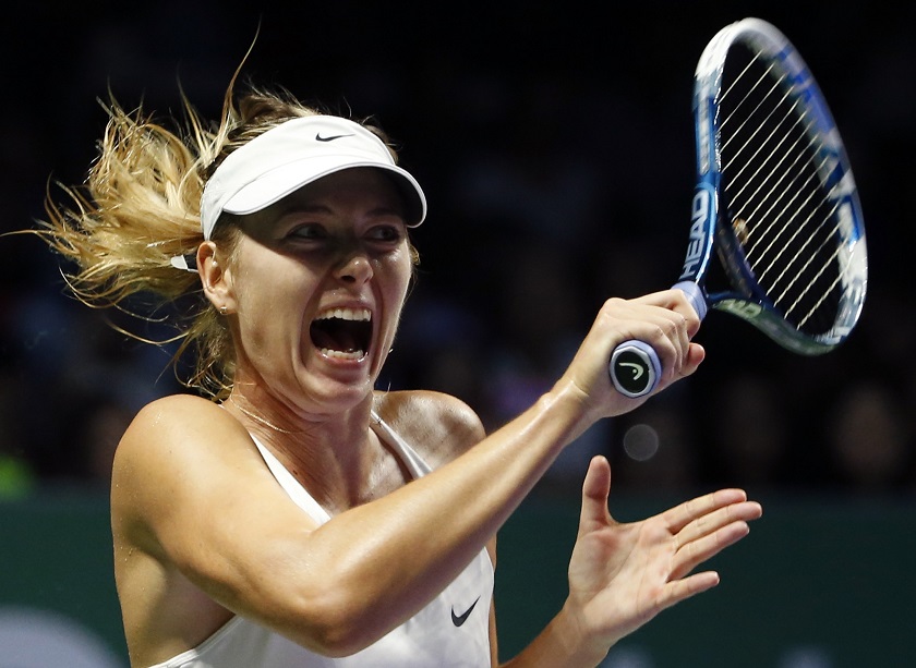 Maria Sharapova of Russia hits a return to Agnieszka Radwanska of Poland during their WTA Finals singles tennis match at the Singapore Indoor Stadium, October 24, 2014. u00e2u20acu201d Reuters pic