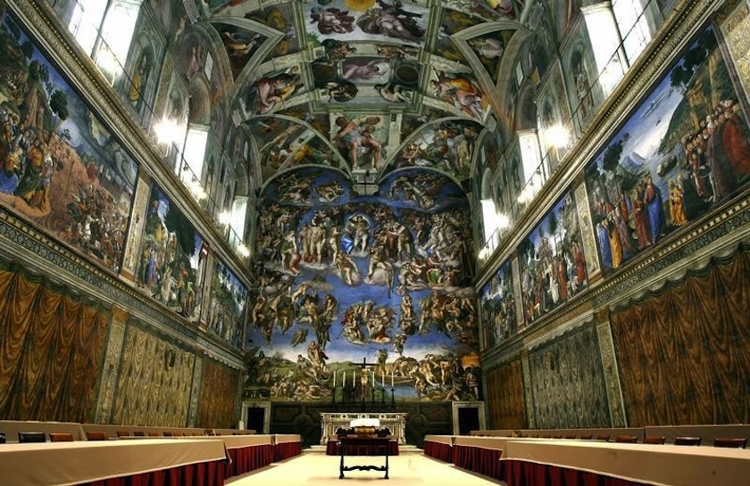 Newly installed tables stand under Michaelangelo's frescoes in the Vatican's Sistine Chapel before next week's conclave April 16, 2005. u00e2u20acu201d Reuters pic