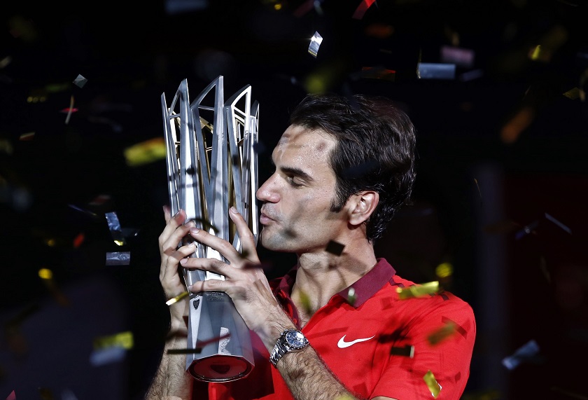 Roger Federer of Switzerland kisses the trophy after winning the menu00e2u20acu2122s singles final match against Gilles Simon of France at the Shanghai Masters tennis tournament in Shanghai October 12, 2014. u00e2u20acu201d Reuters pic