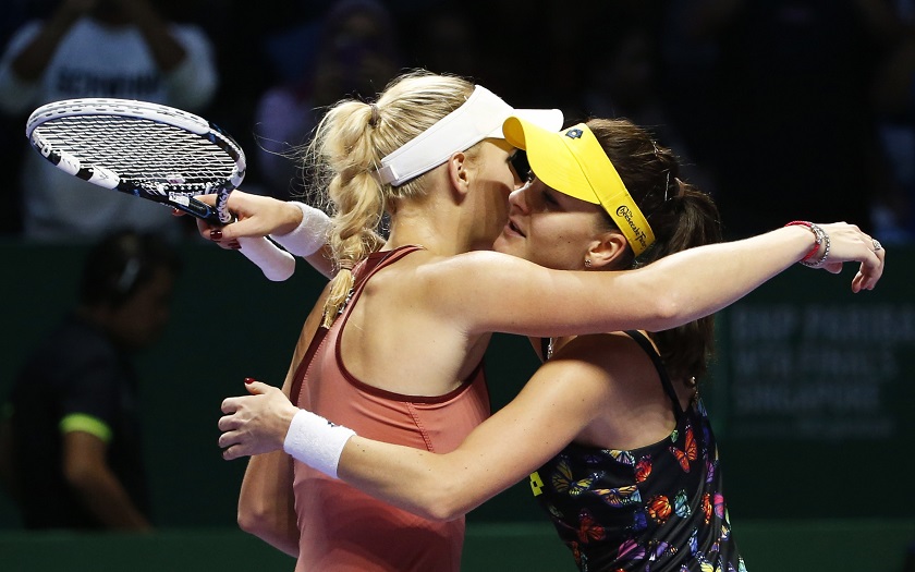 Caroline Wozniacki of Denmark is congratulated by Agnieszka Radwanska of Poland during their WTA Finals singles tennis match at the Singapore Indoor Stadium, October 23, 2014. u00e2u20acu201d Reuters pic